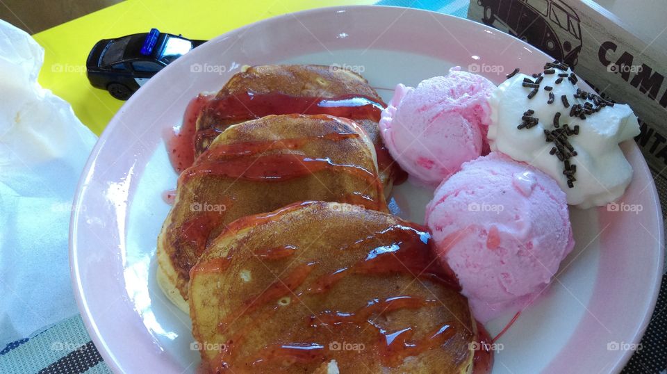 Pancake with strawberry ice-cream.