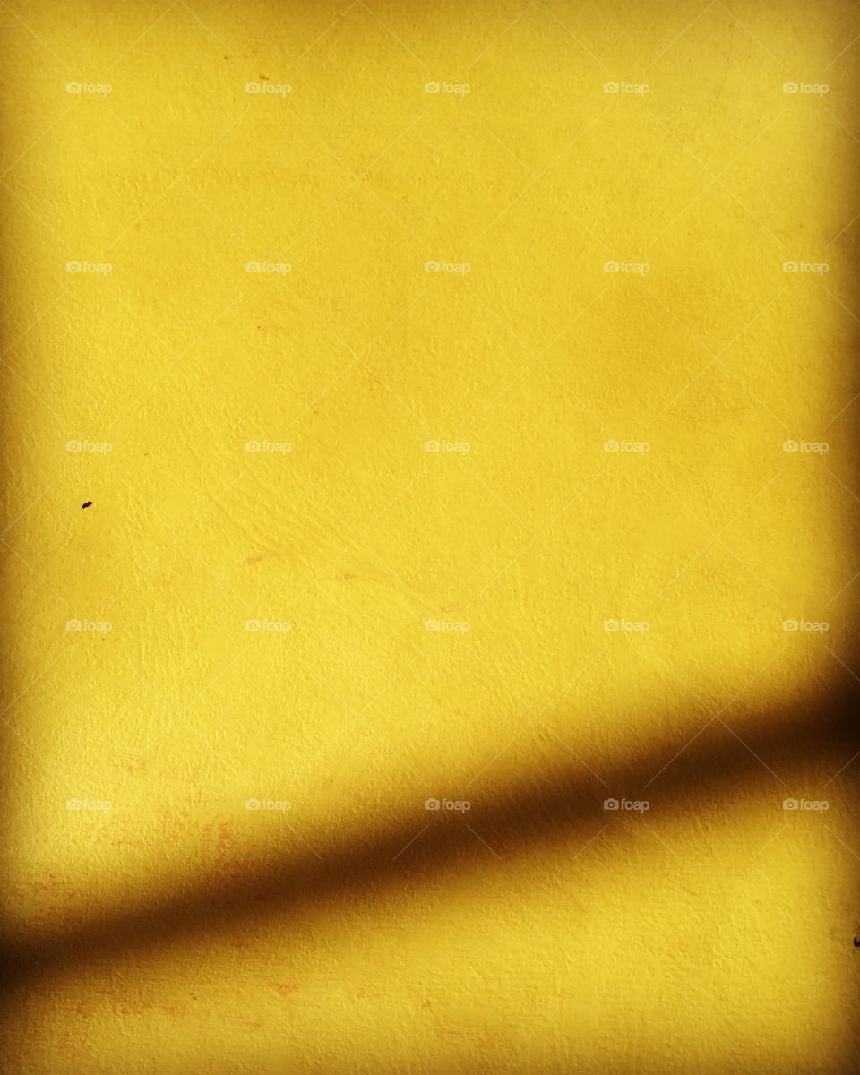 Vivid yellow texture paper with shadow 