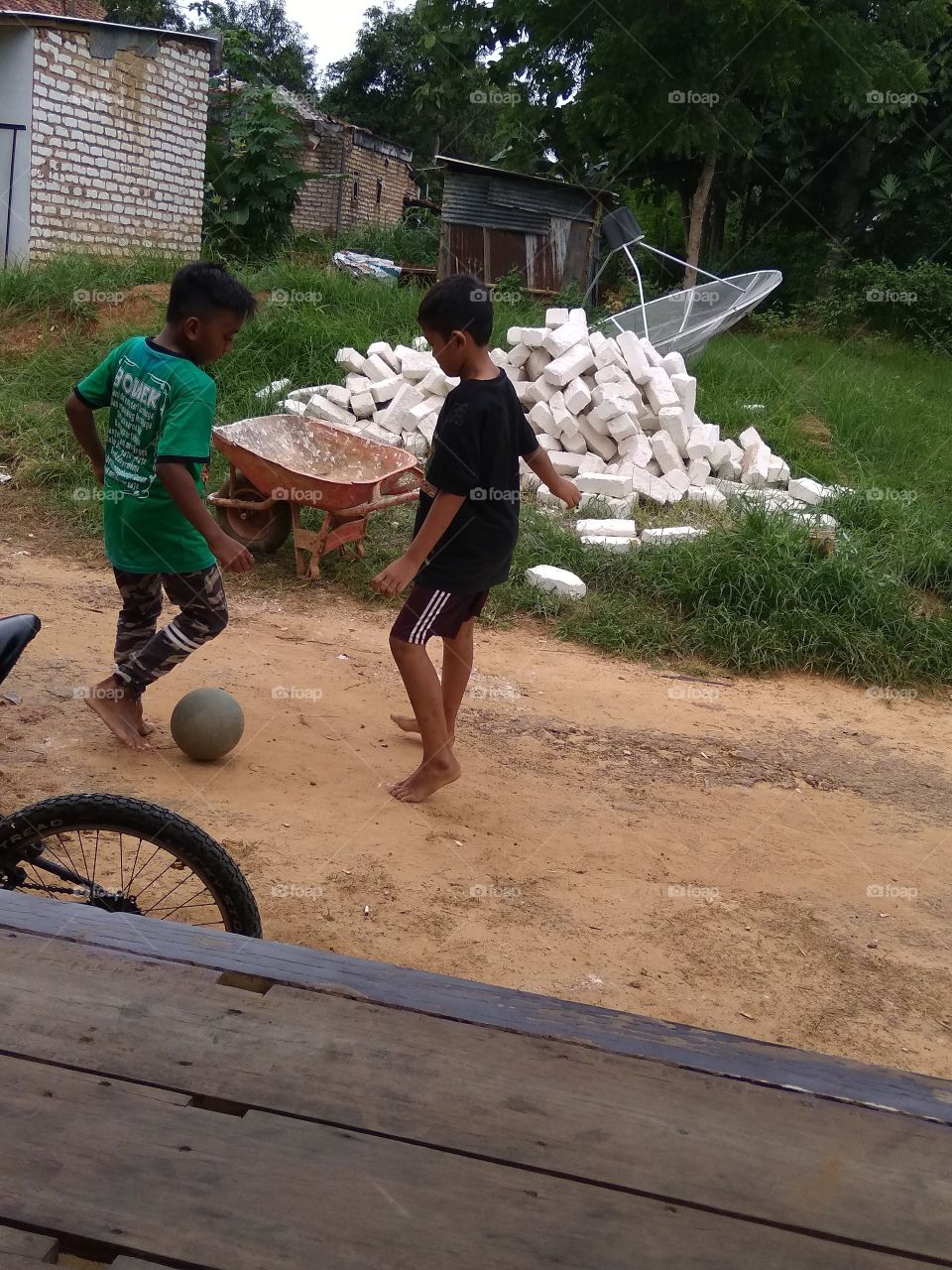 The village boy is happy to play happily