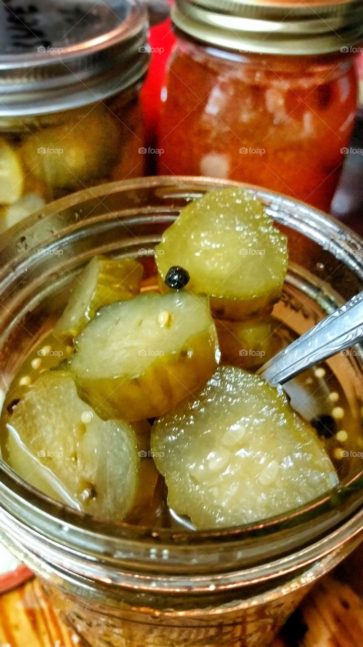Homemade jar of open sweet pickles