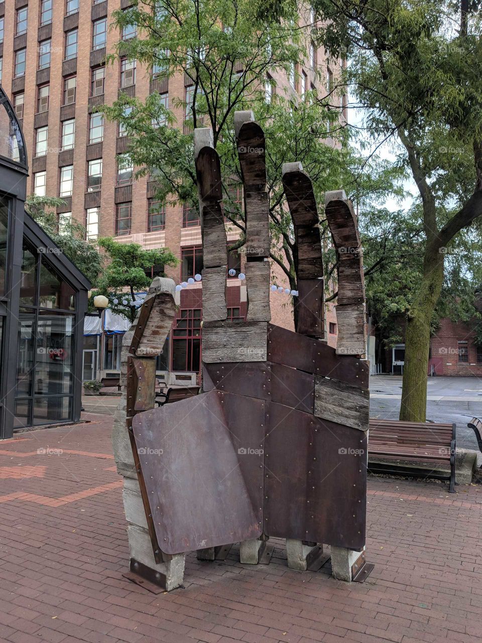 Large Wood and Metal Waving Hand Sculpture in Downtown Syracuse, New York