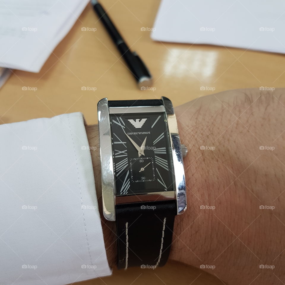 man's modern black wristwatch