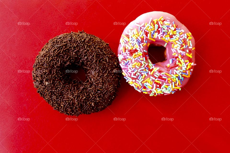 Two donuts on red background