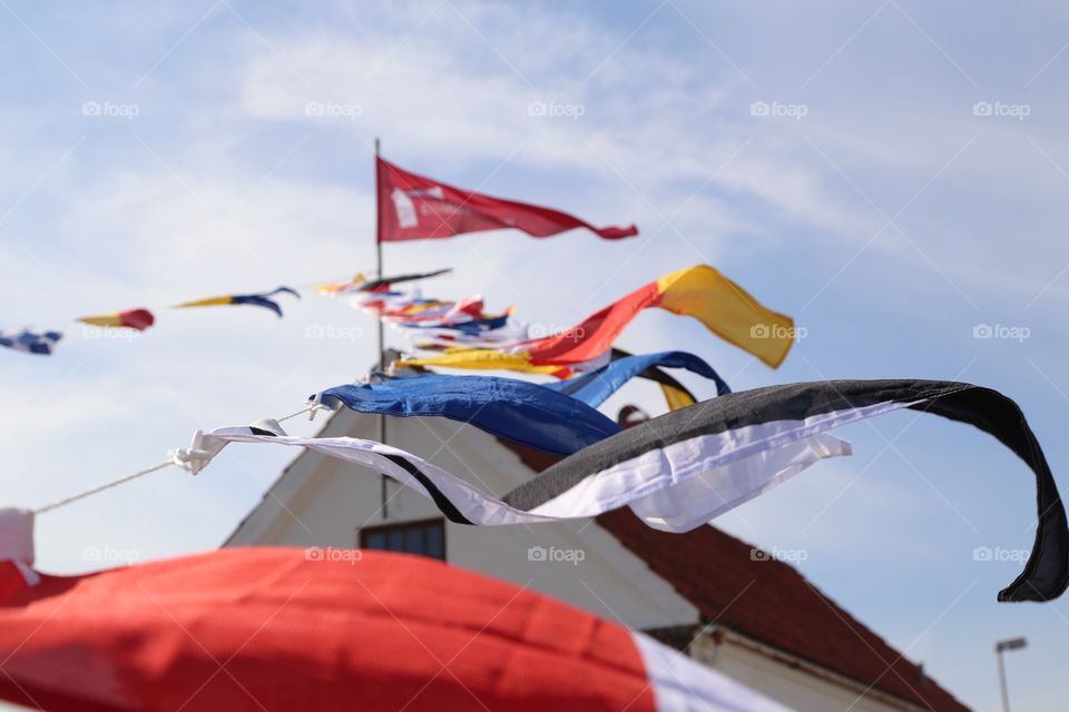 Different flags moving in the wind