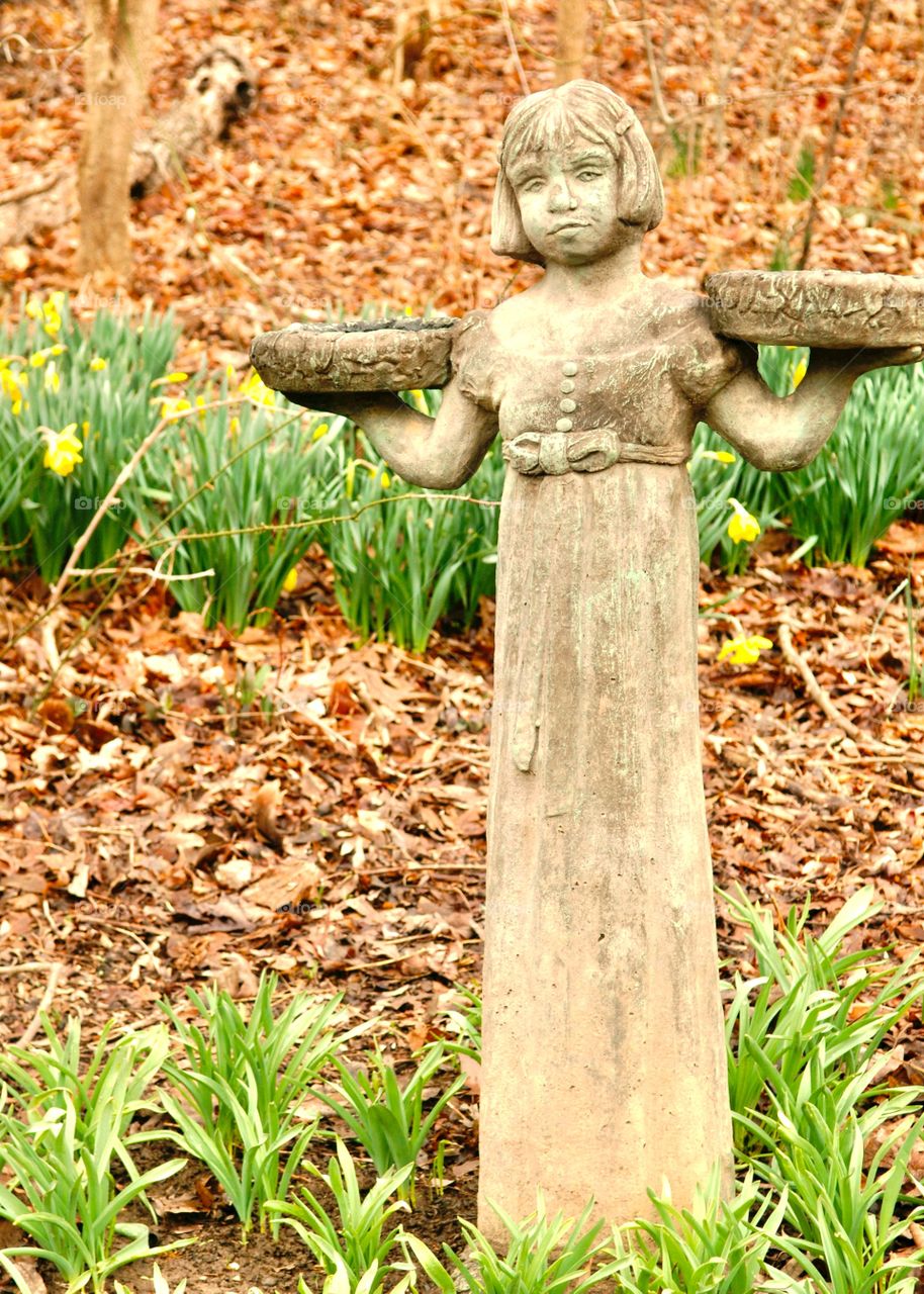 Girl statue. Statues of the arboretum 