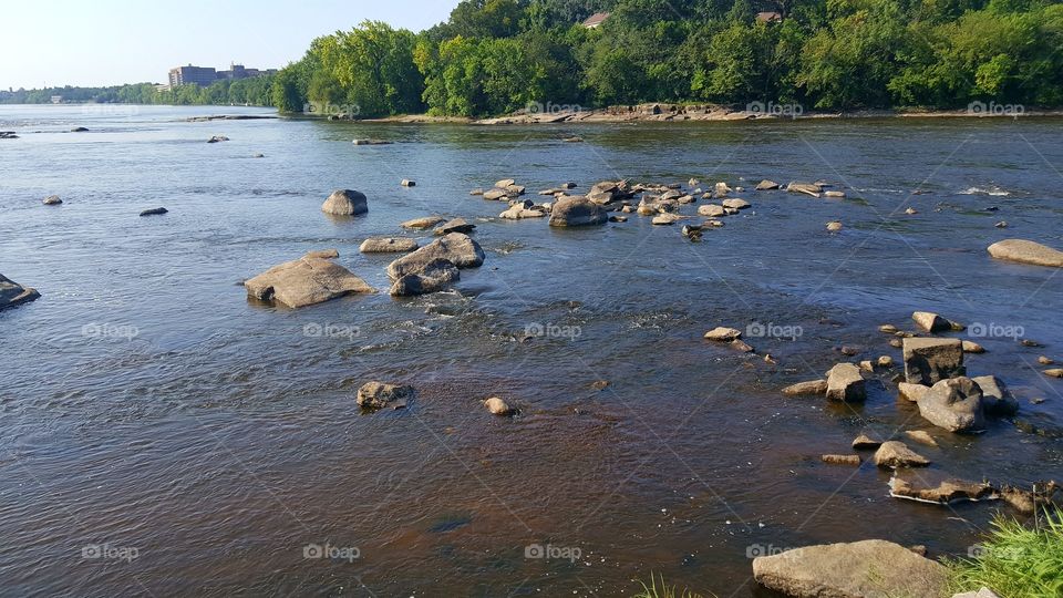Mississippi River  with water flowing around boulders