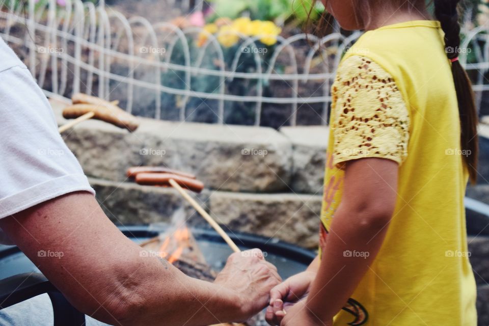 Girl buying sausages in market