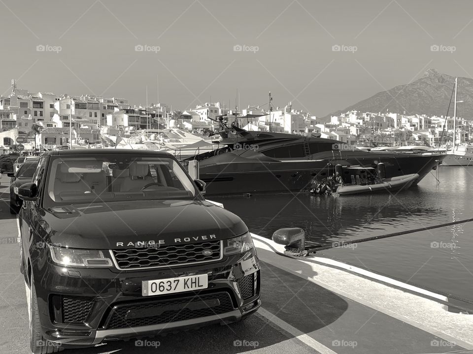 Stealth Yacht and Range Rover at PuertoBanus Harbour, Marbella Spain. Taken with iPhoneXR