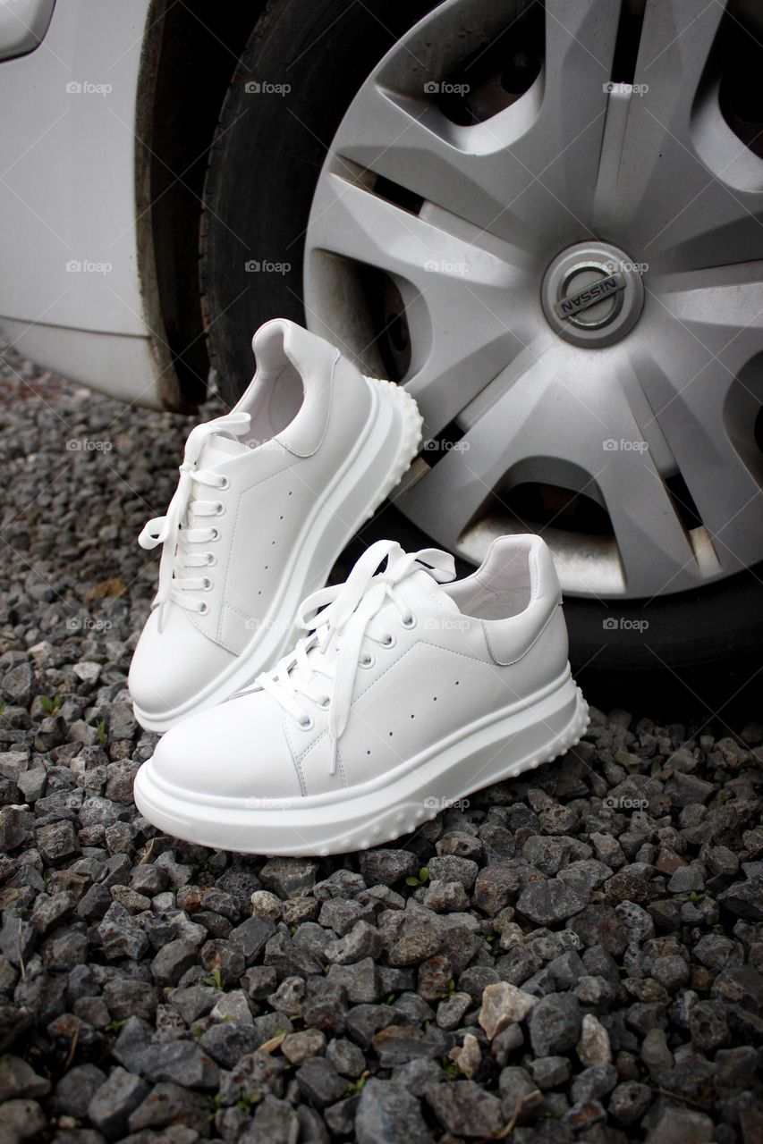 White stylish sneakers are ready to go, what about owner?