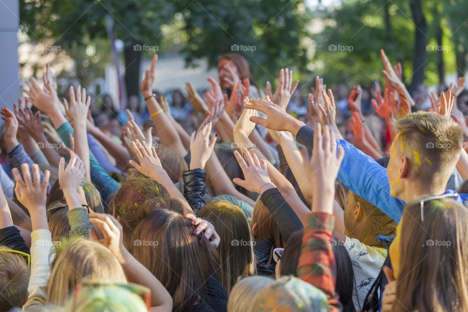 Crowd cheering at the outdoor concert