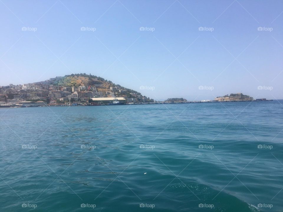 Sunny day at the sea. Island view. Vacation in Kusadasi. Turkish riviera. Summertime in beautiful locations. Landscape view ocean blue sky