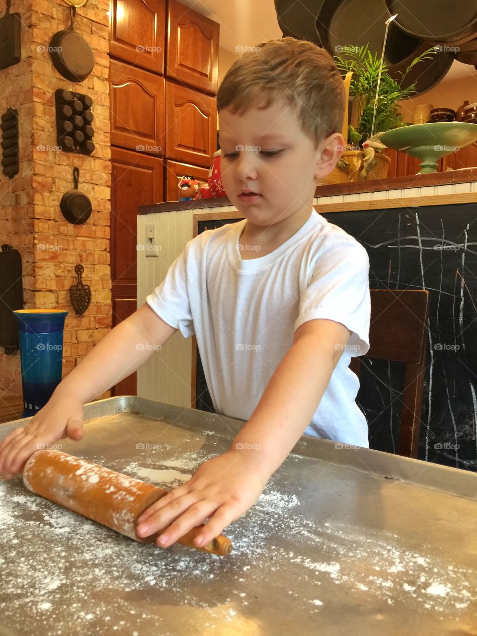 Boy holding rolling pin