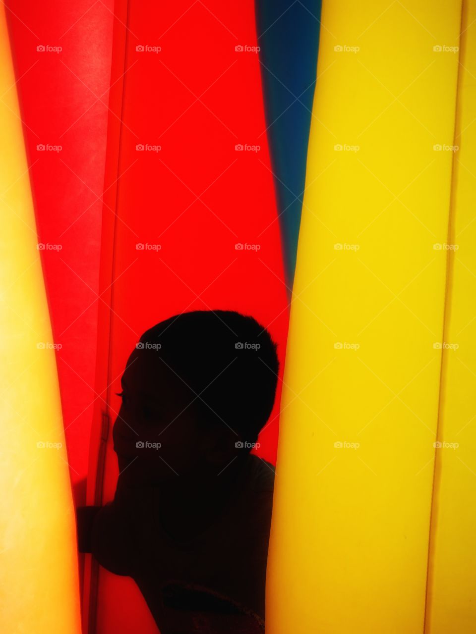 Child between curtains