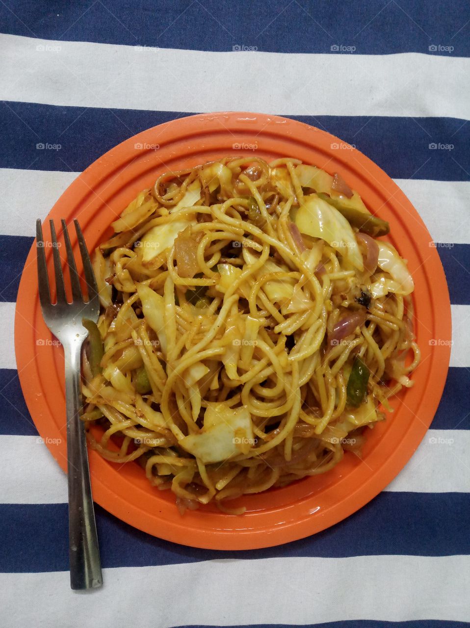Spaghetti is a long, thin, solid, cylindrical pasta. It is a staple food of traditional Italian cuisine. Like other pasta, spaghetti is made of milled wheat and water and sometimes enriched with vitamins and minerals.