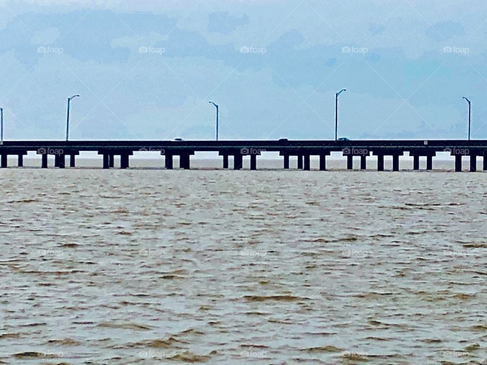 Bridge over water with blue sky