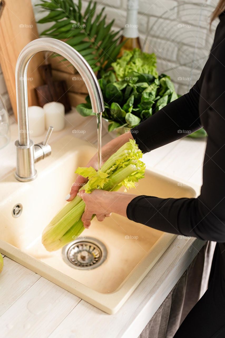 woman washing celery