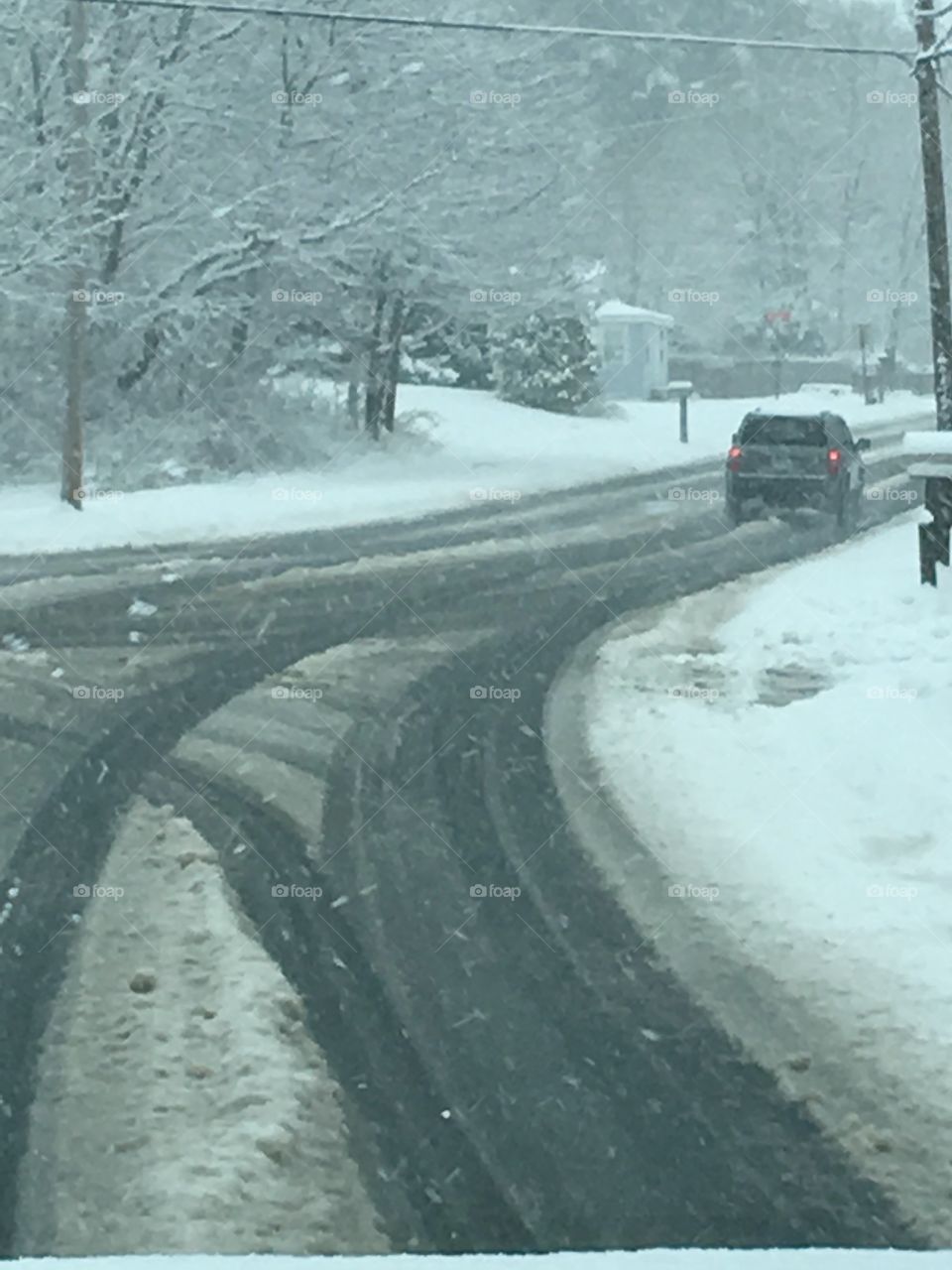 Snowstorm Not Even Plowed Once Yet

This is a busy street and this is what it looks like when a plow hasn't had a chance to make a pass through yet. Just drive slow people!!!
