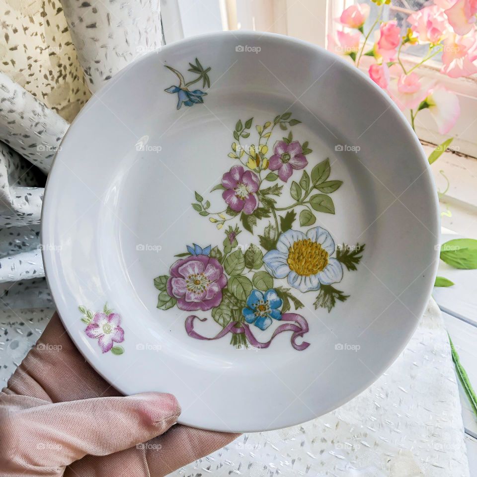 Vintage dessert porcelain plate with floral plot