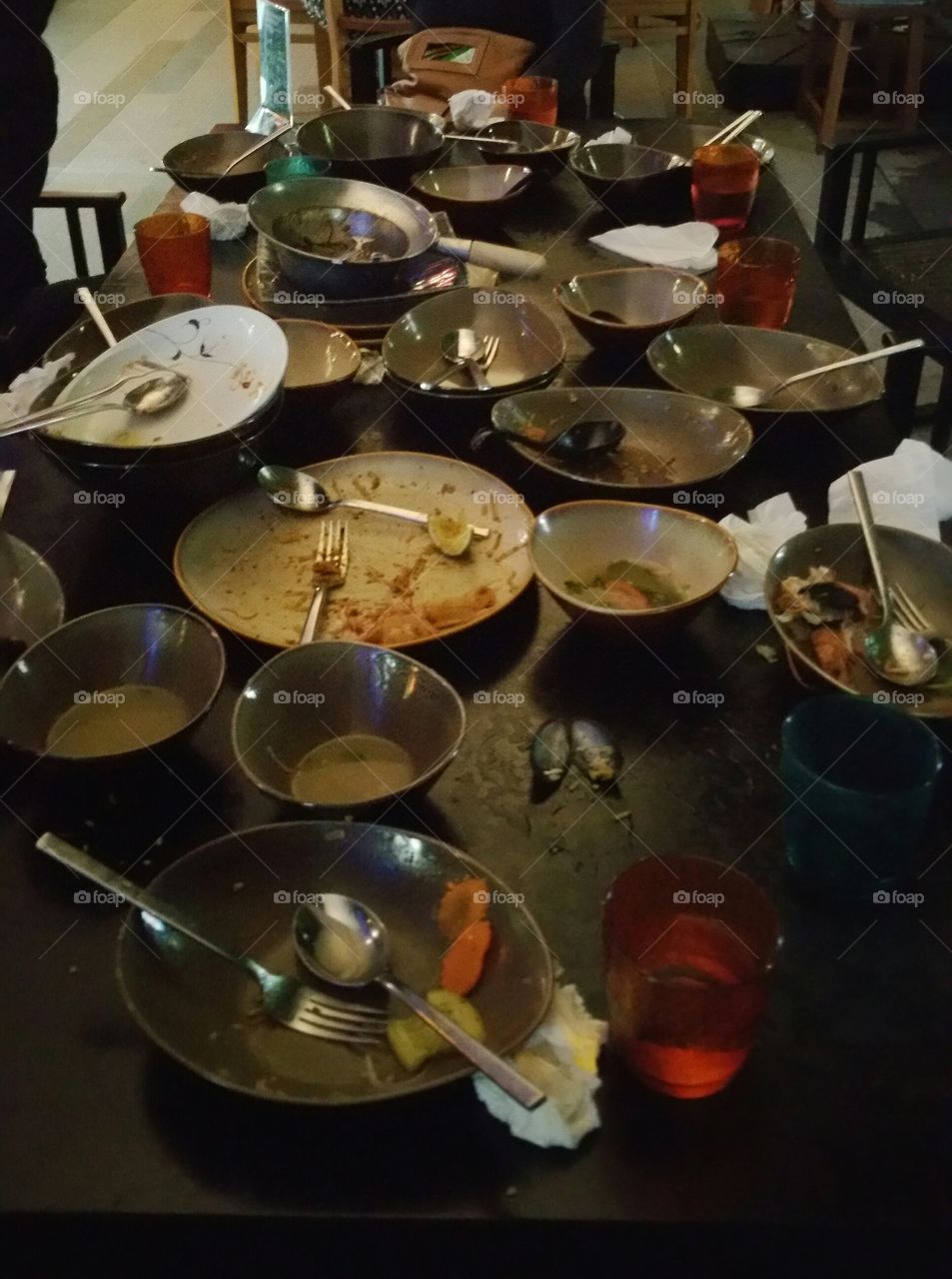 After dinner at dining table, left with empty plates and bowls.