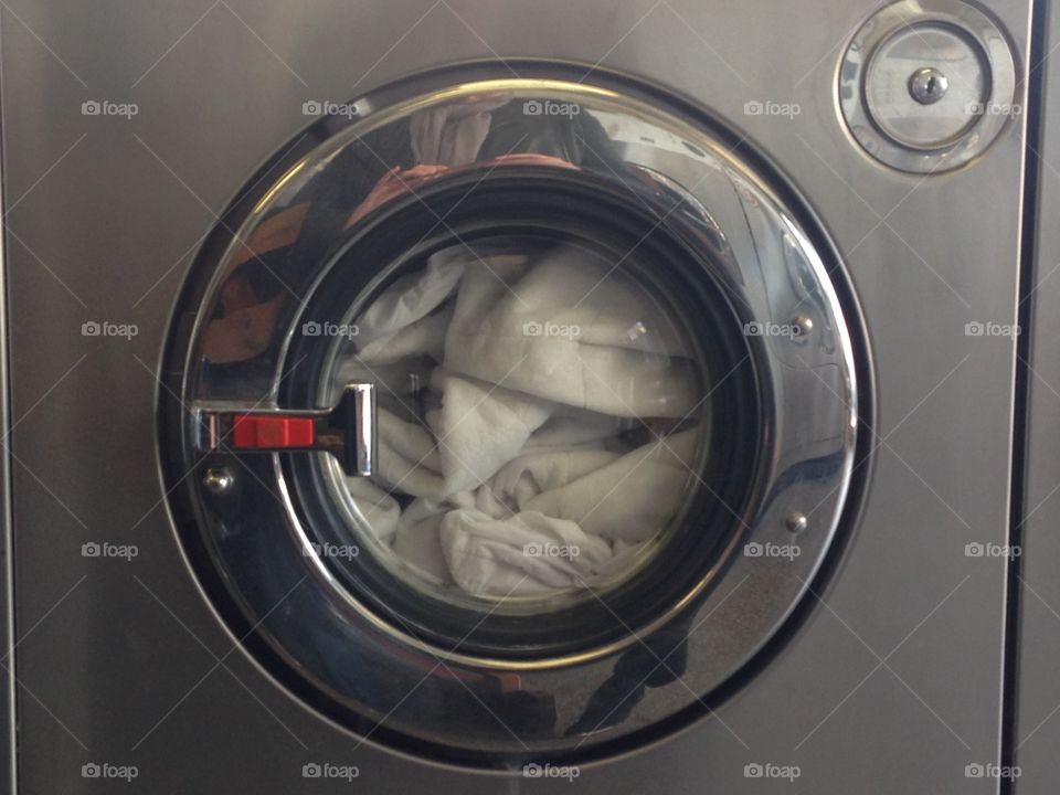 Silver washing machine at launderette