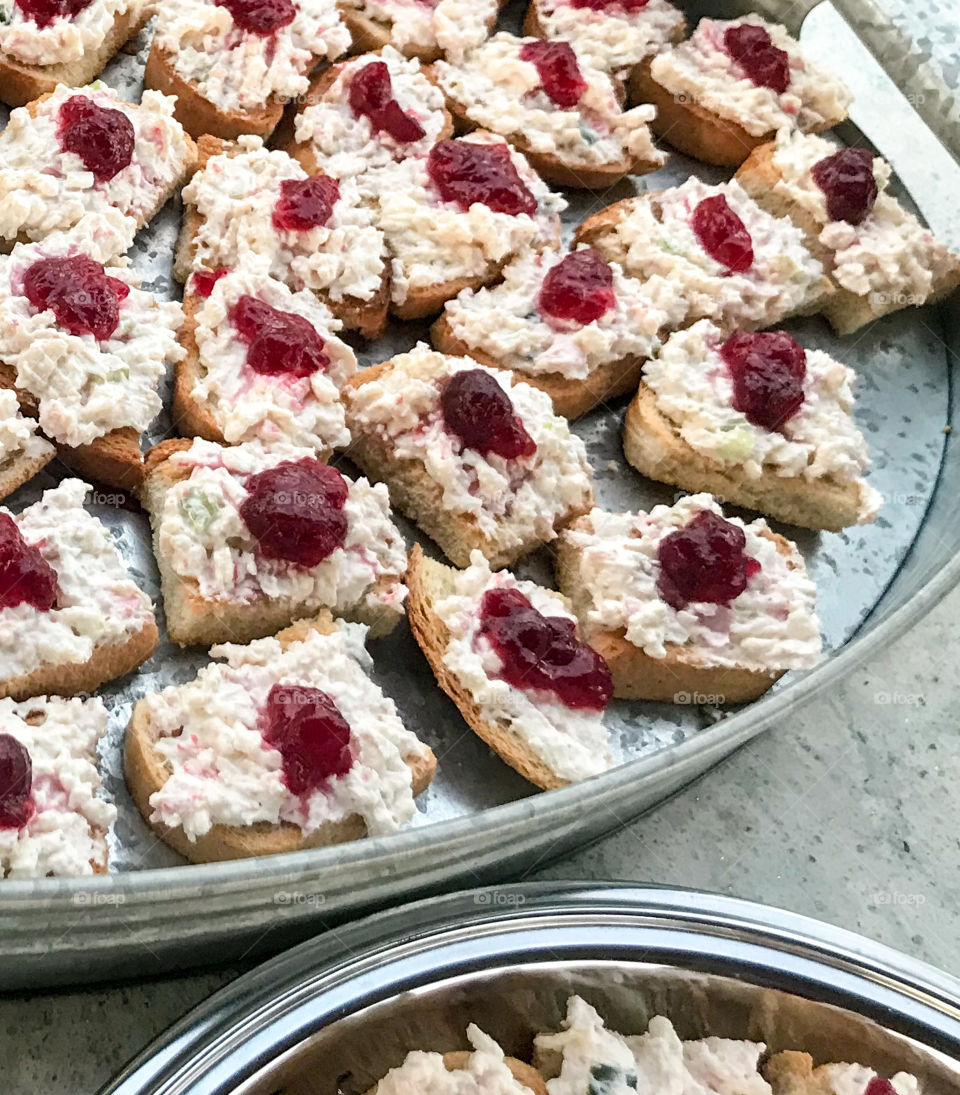 Cooking at home crab dip on baguettes with cranberry 