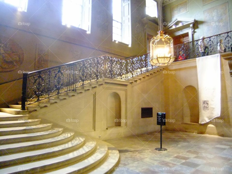 Grand staircase inside Hampton Court Palace 
