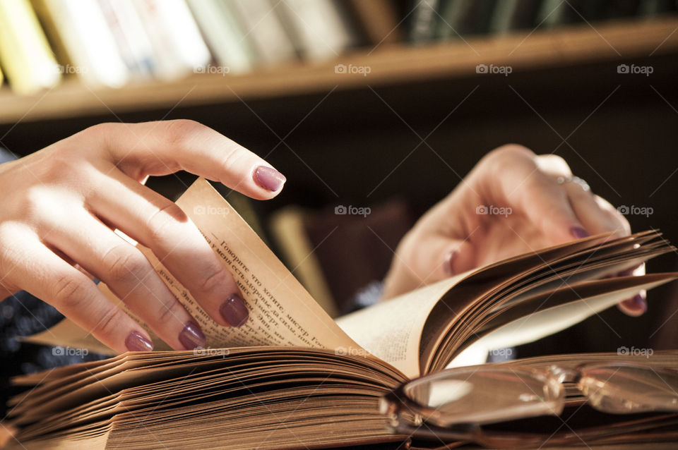 girl reading a book in the library