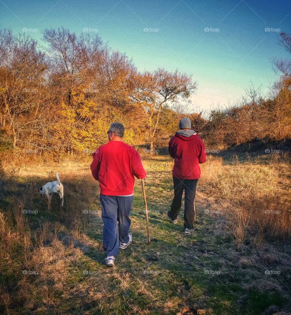 Father Son and Dog Hiking Together