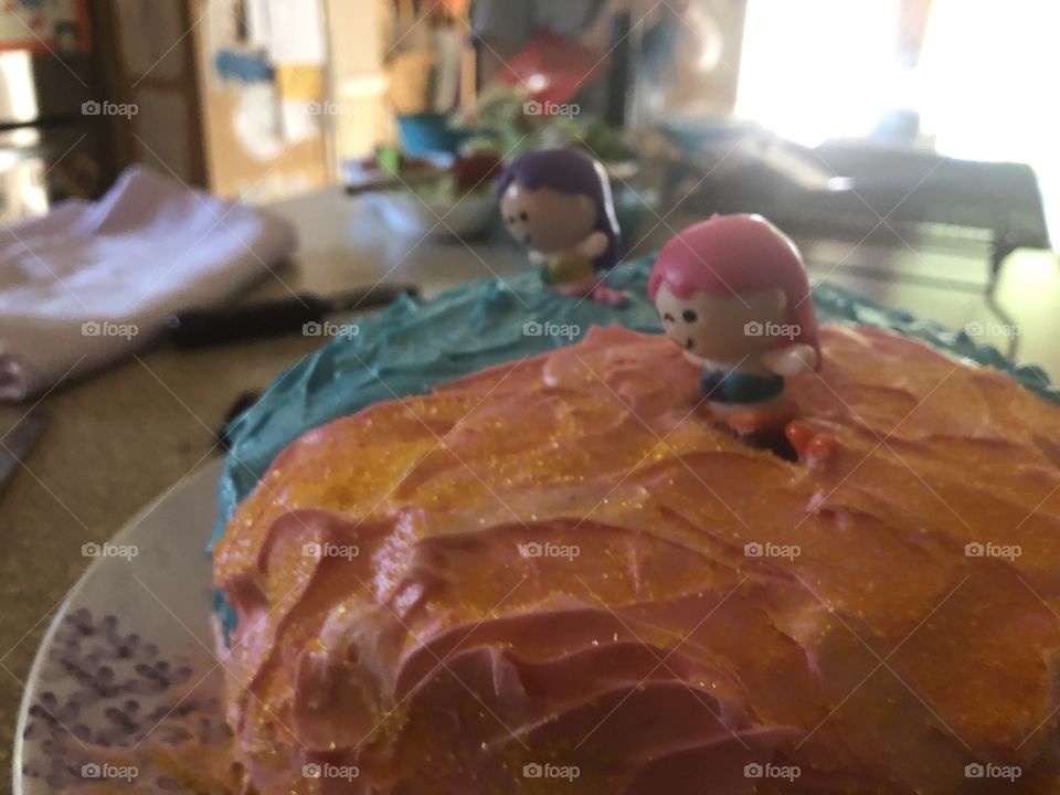 Birthday cake with mermaids on it