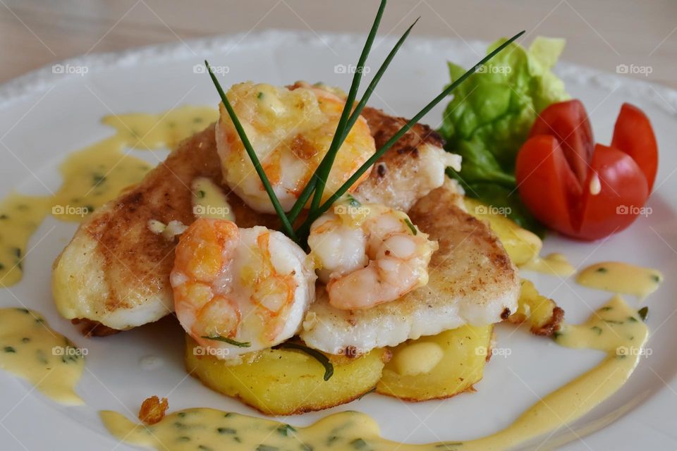 Delicious pancakes with shrimp and side dishes