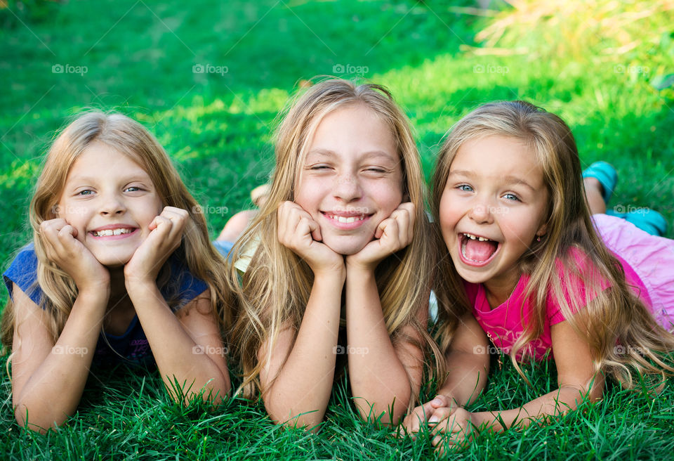 Group of friends lying on grass