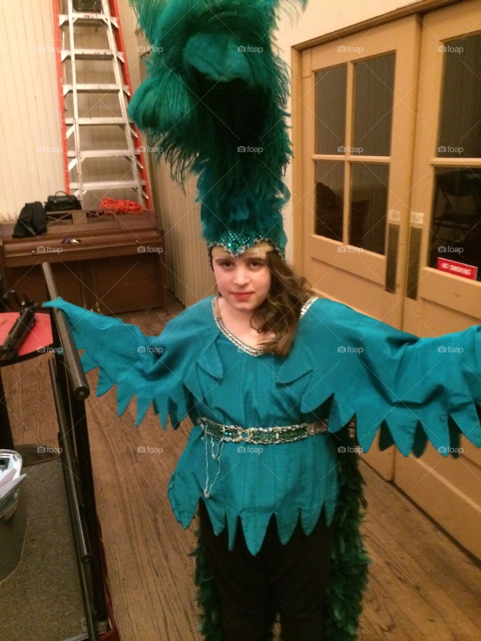 Girl in green bird costume