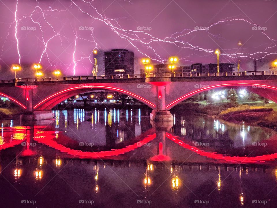 City bridge water lightning red