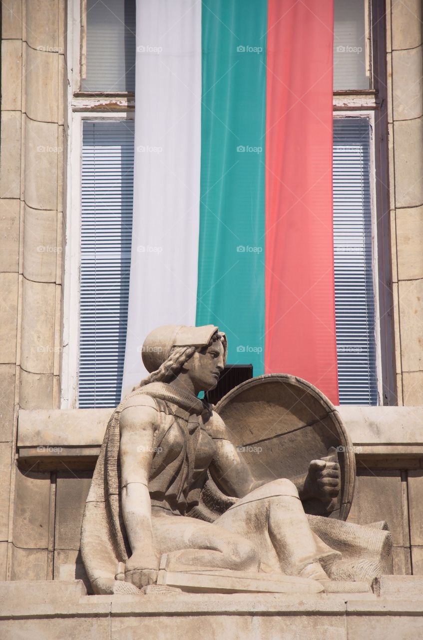 Ruse,Русе, statue with bulgarian flag on a building