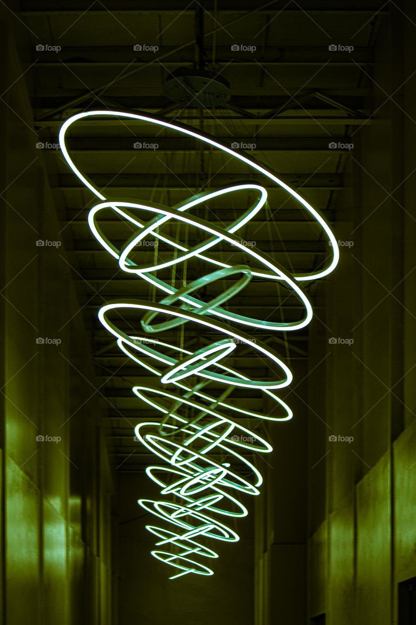 Multiple yellow green LED ceiling lights as a room lighting and ambiance making a great and stylish hallway design in a straight angle.