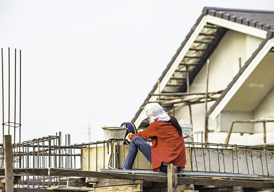 Female Workers tied steel beam construction.