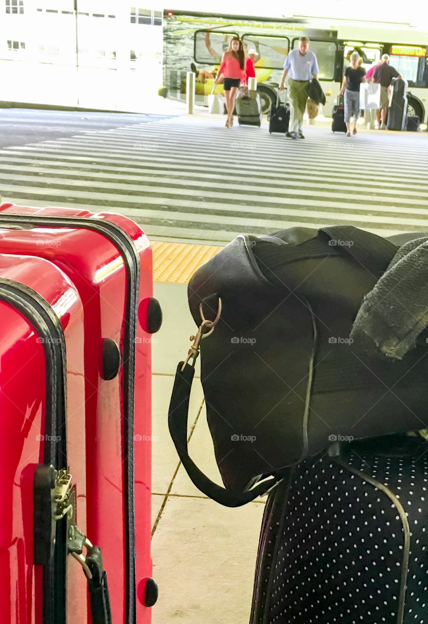 Red luggage suitcases valises at airport outdoors 