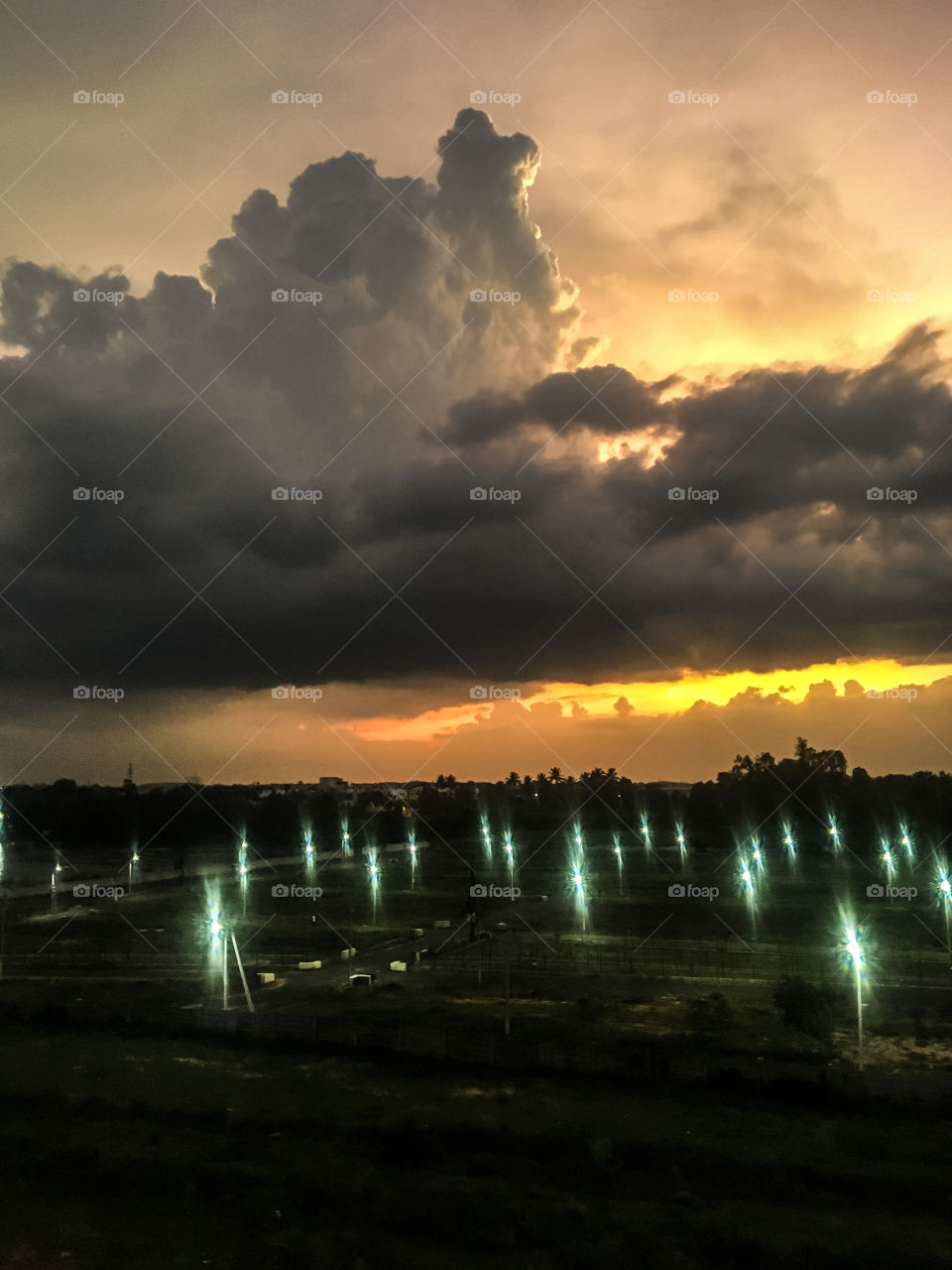 Day turning into Night and so the artificial lights are on while the natural light is coming down