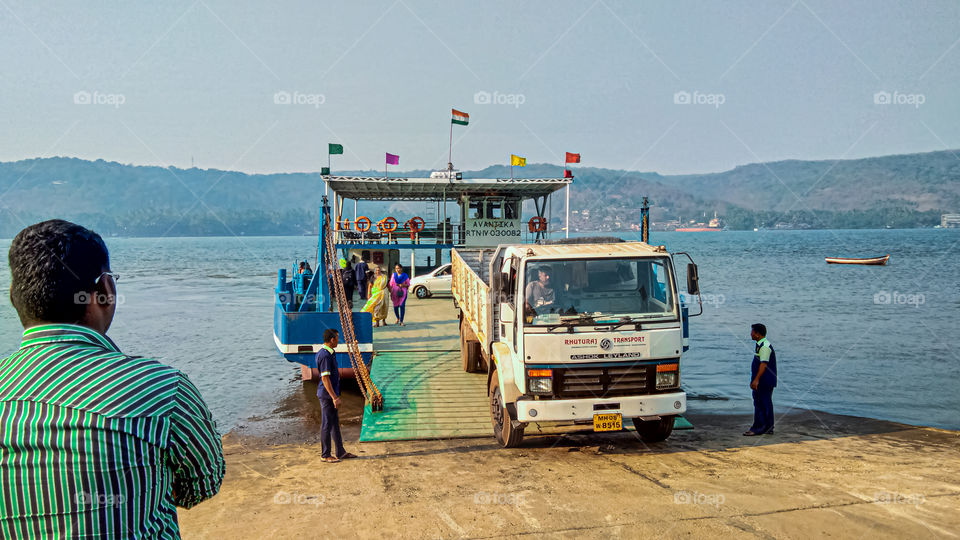 Transport Service with Boat for Vehicles and Public.