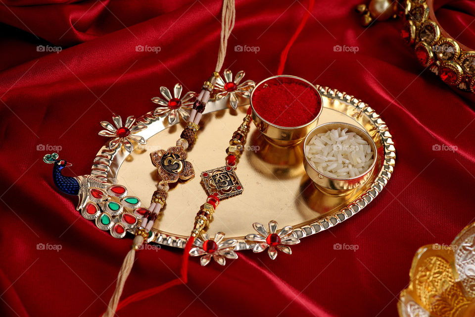 traditional Indian festival raksha Bandhan on red satin