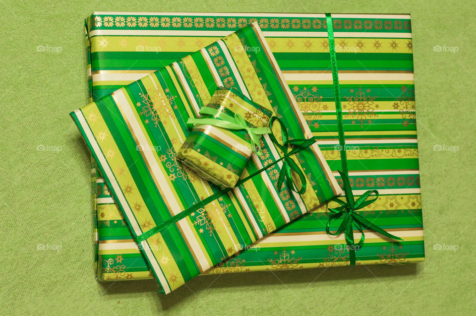 Few presents in green paper from above 