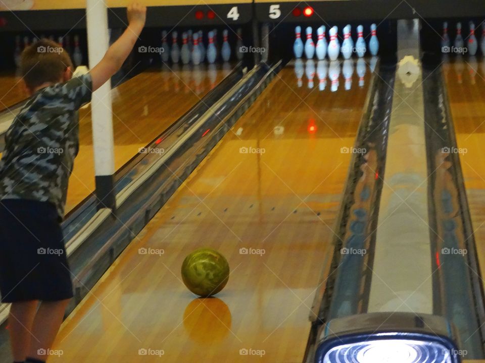 Boy In A Bowling Alley
