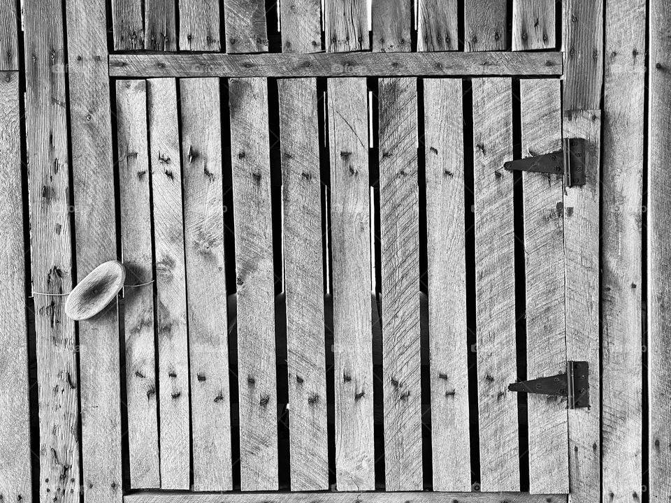 A door in an old wooden barn