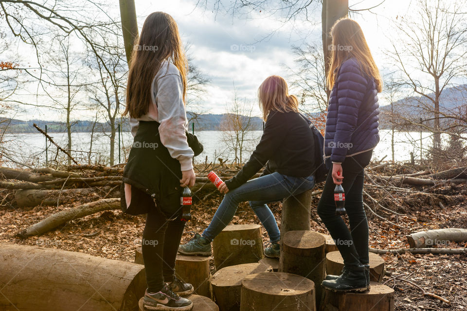 woman and two girls looking the nature