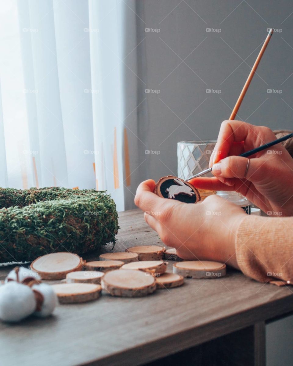 photo of a woman crafting an Easter wreath made only from eco friendly materials