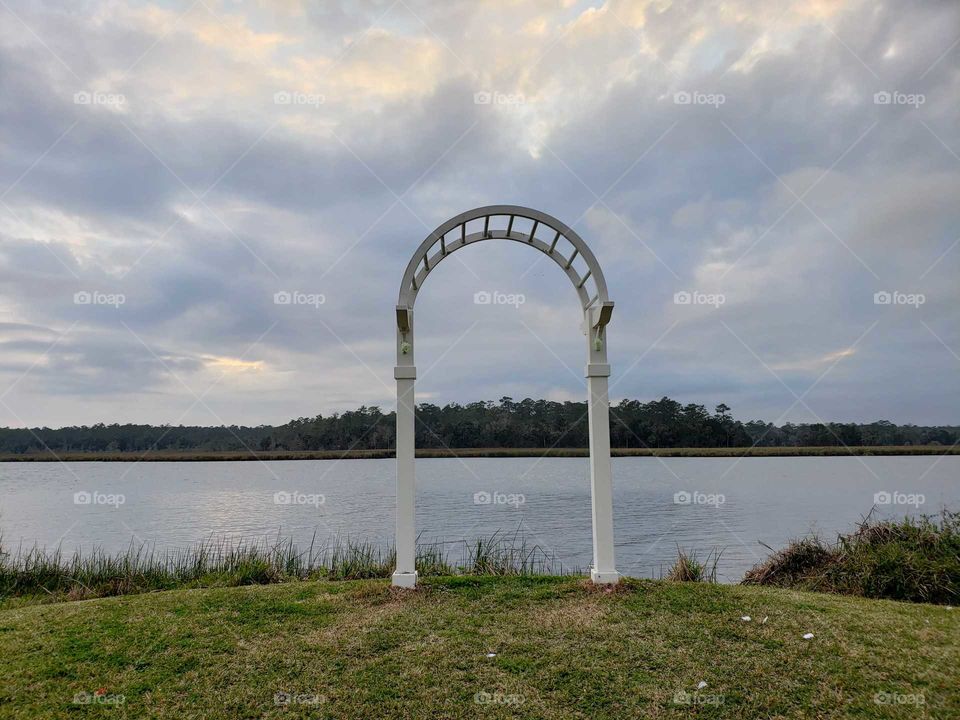 white wedding arch on River bank