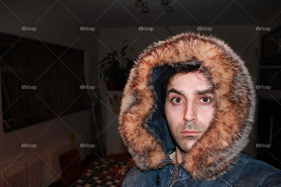 Portrait of a model with a thick hood jacket