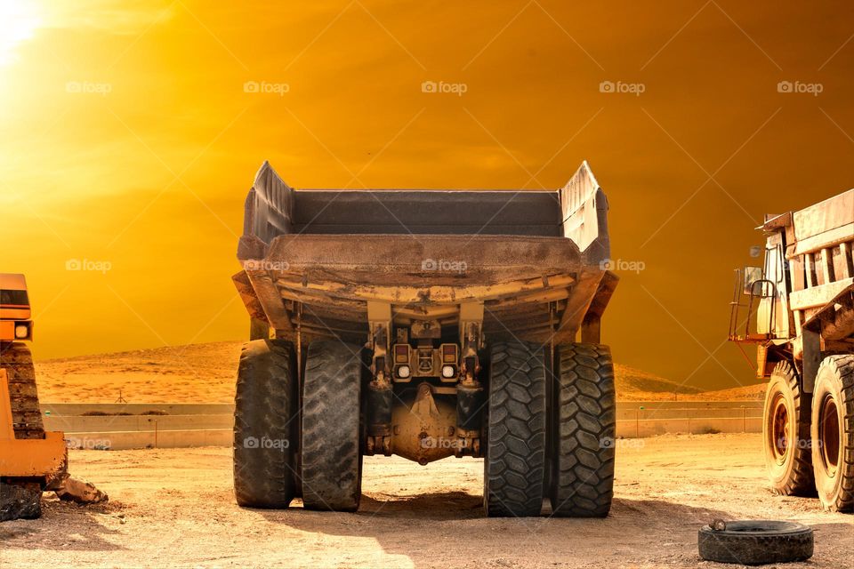 Rear view of large dump truck in apocalyptic scenario