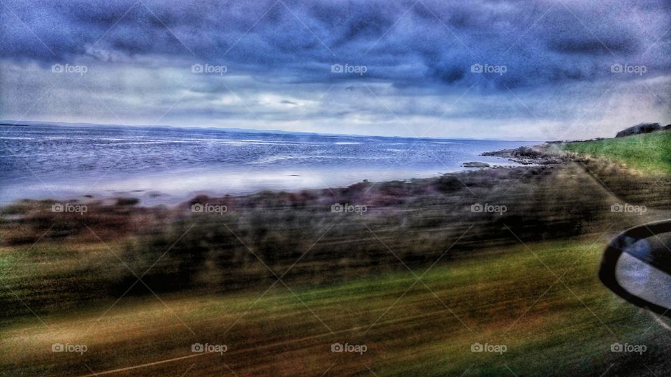 A view of the irish coastline from a car