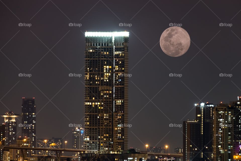 Full moon and skyscraper scene